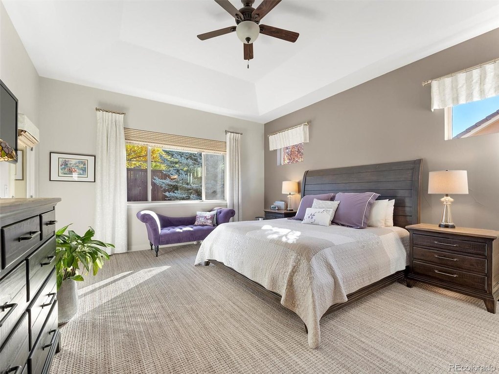 Primary Suite with door to patio and large picture window to private back yard