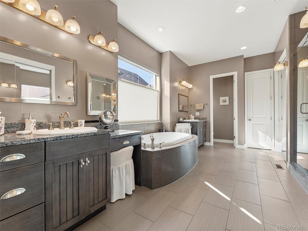 Beautiful Ensuite primary bath with soaking tub, large shower and double vanity cabinets
