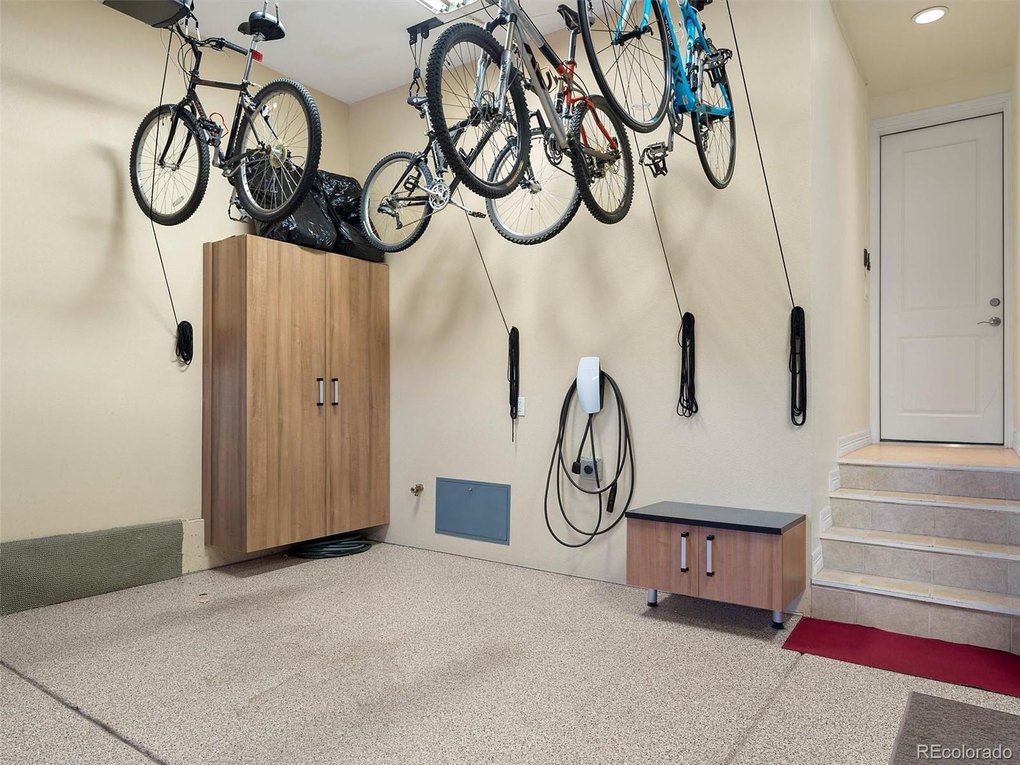 Garage with bike racks, EV Charger and storage cabinets all included