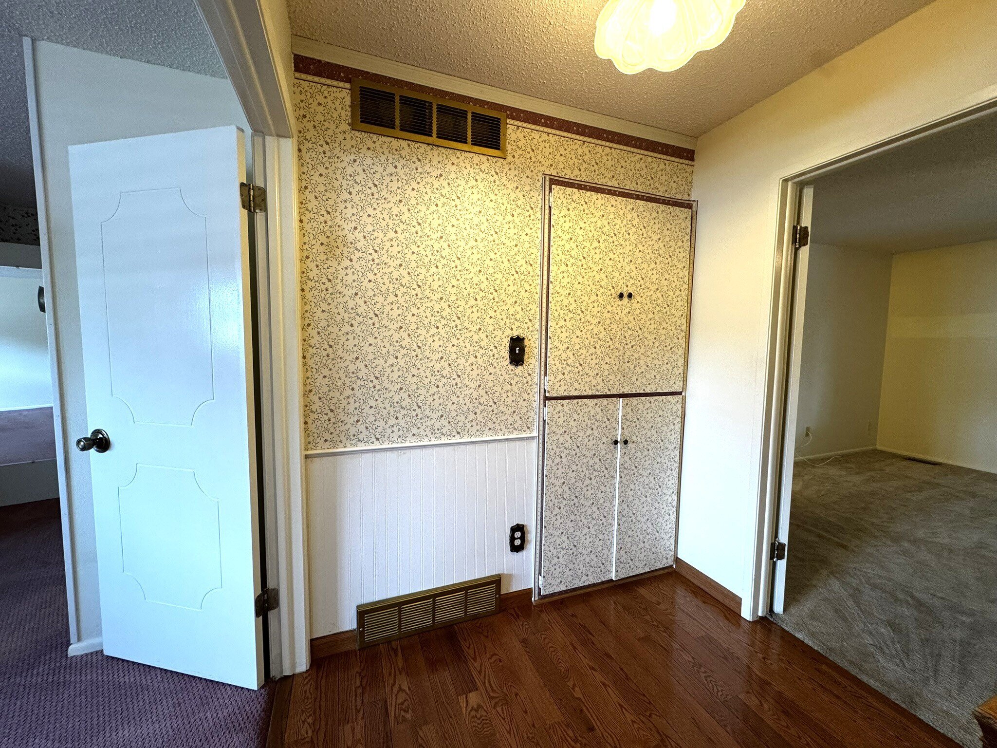 Charming Linen Cabinets Between Bedrooms