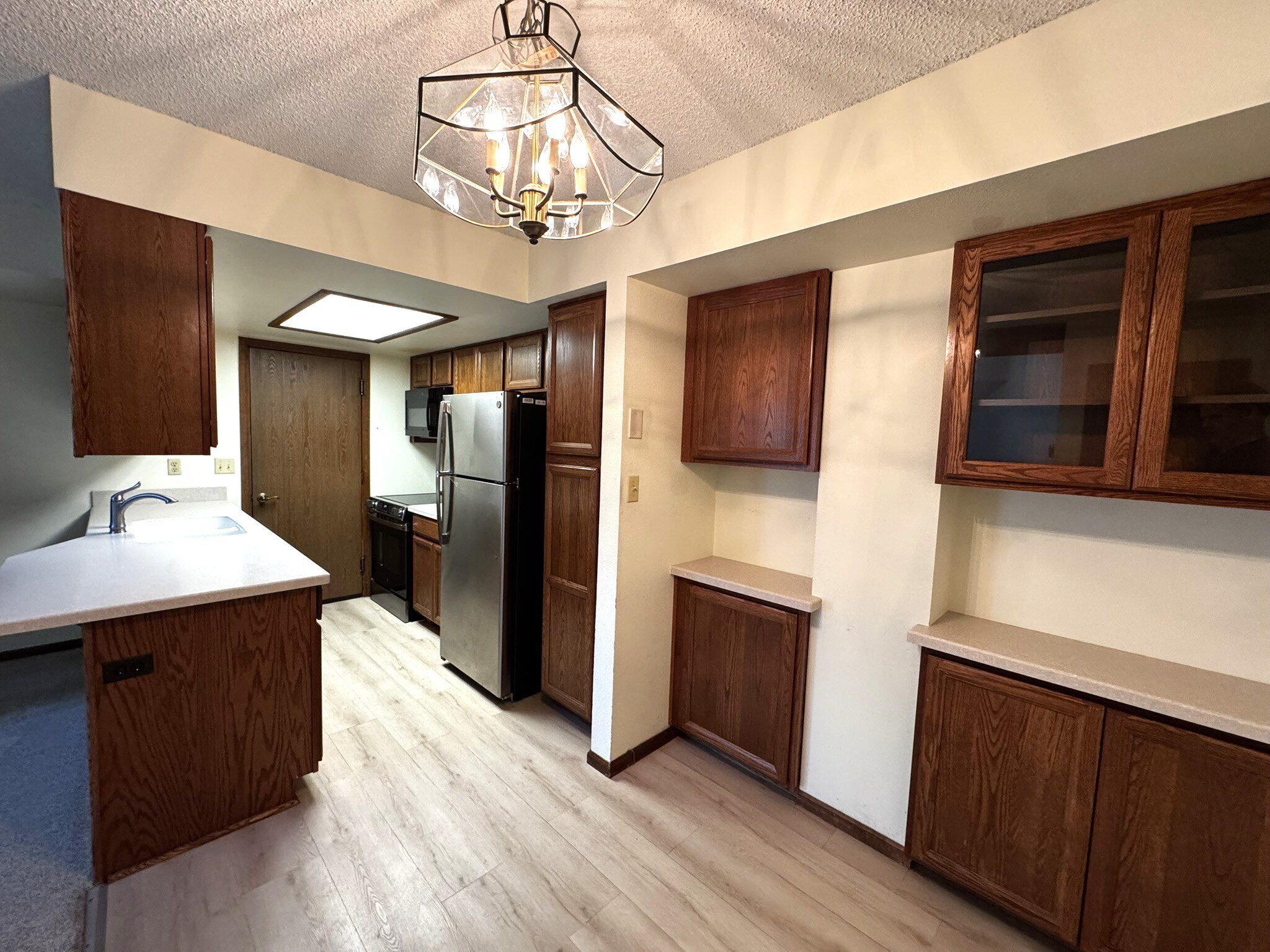 Kitchen - Stainless Appliances and Corian Counter
