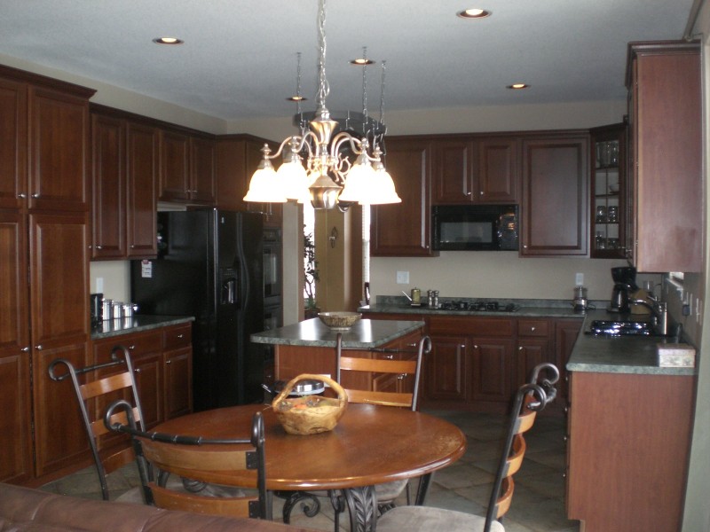Bring the Chef to this wonderful kitchen with cherry cabinets and double oven!