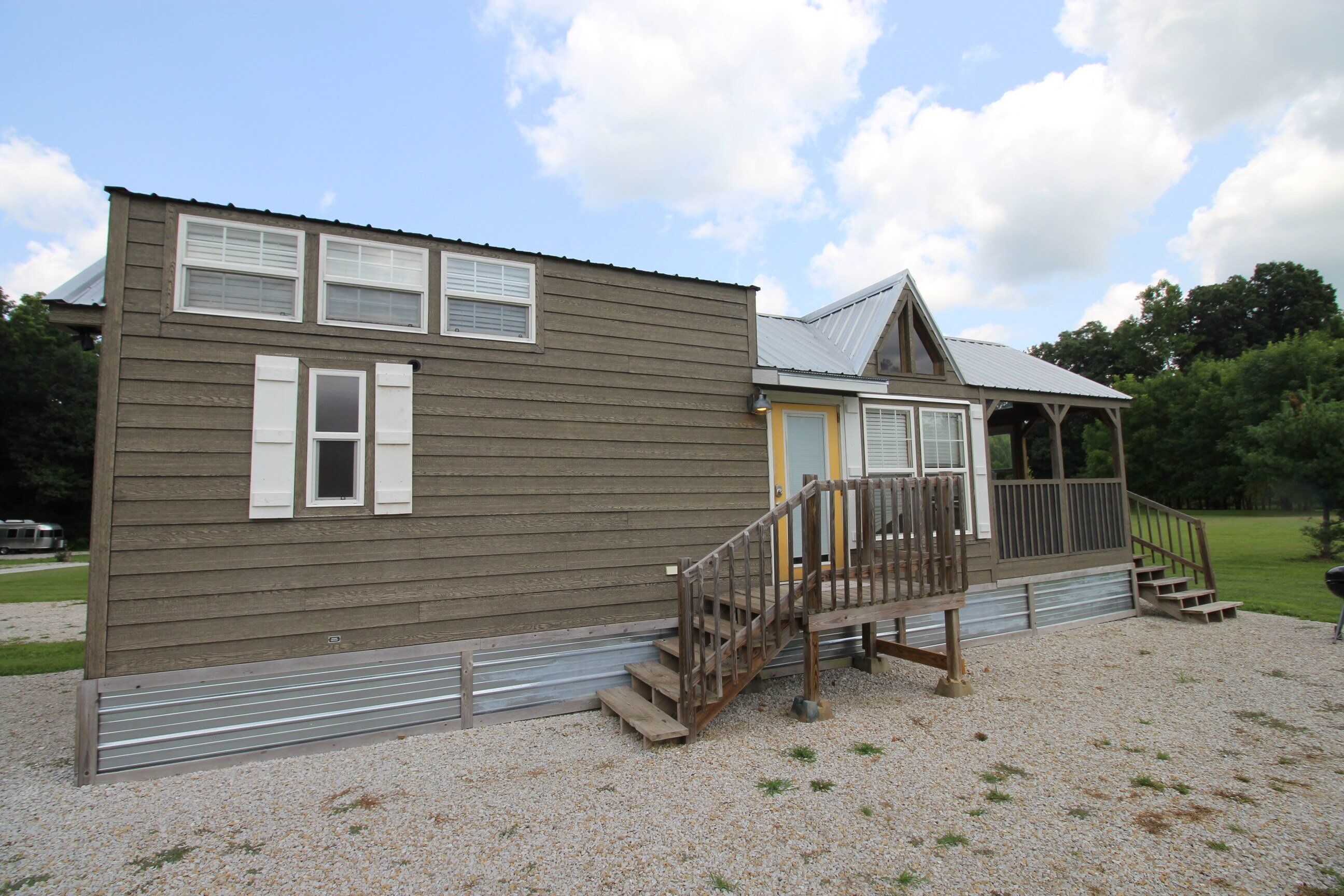 Outside view showing windows to the loft for natural light.