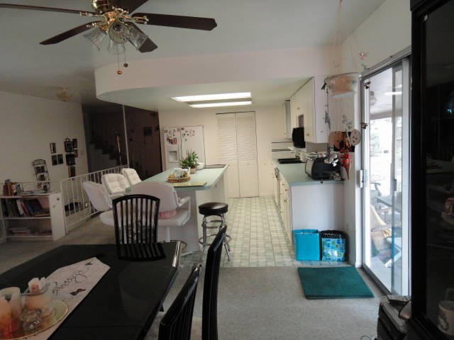 The kitchen features an island with a cooktop!