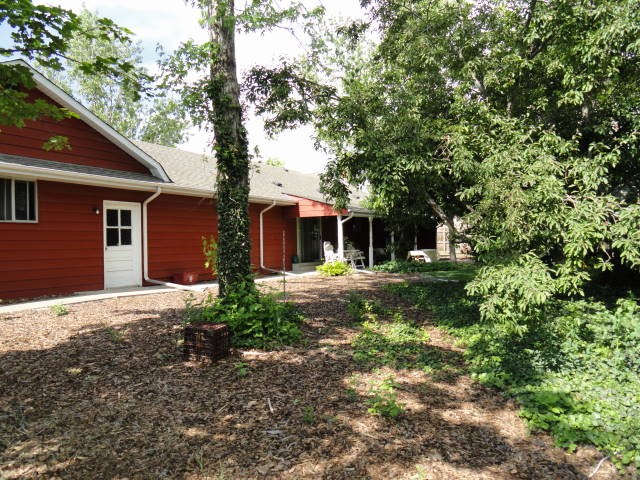 The back yard is fully fenced with a covered patio!