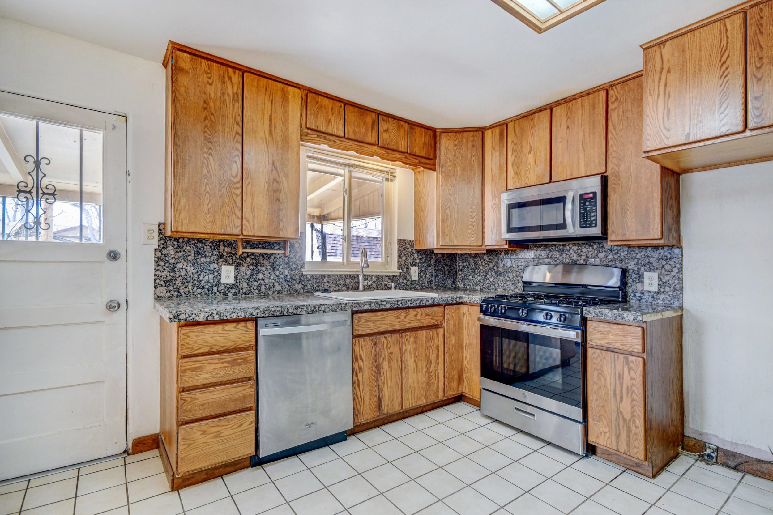 Brand New Stainless appliances and granite tile countertops
