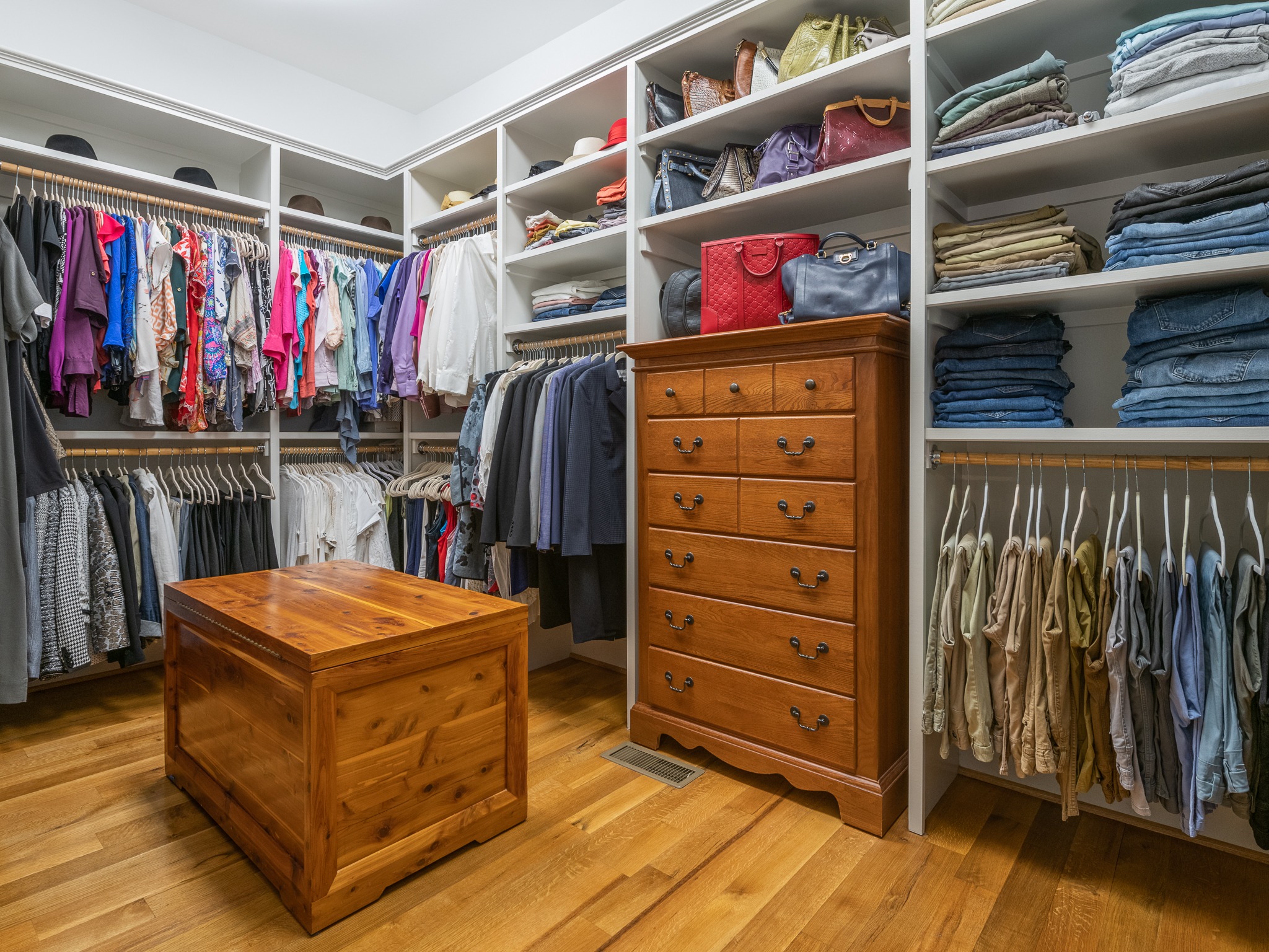 Large walk in primary closet with built ins