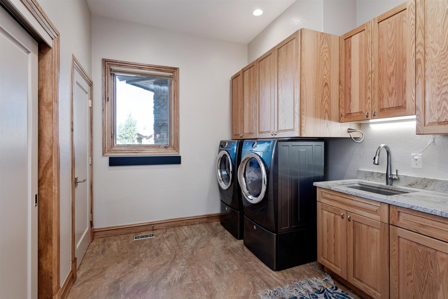 Large Laundry Area with a Utility Sink