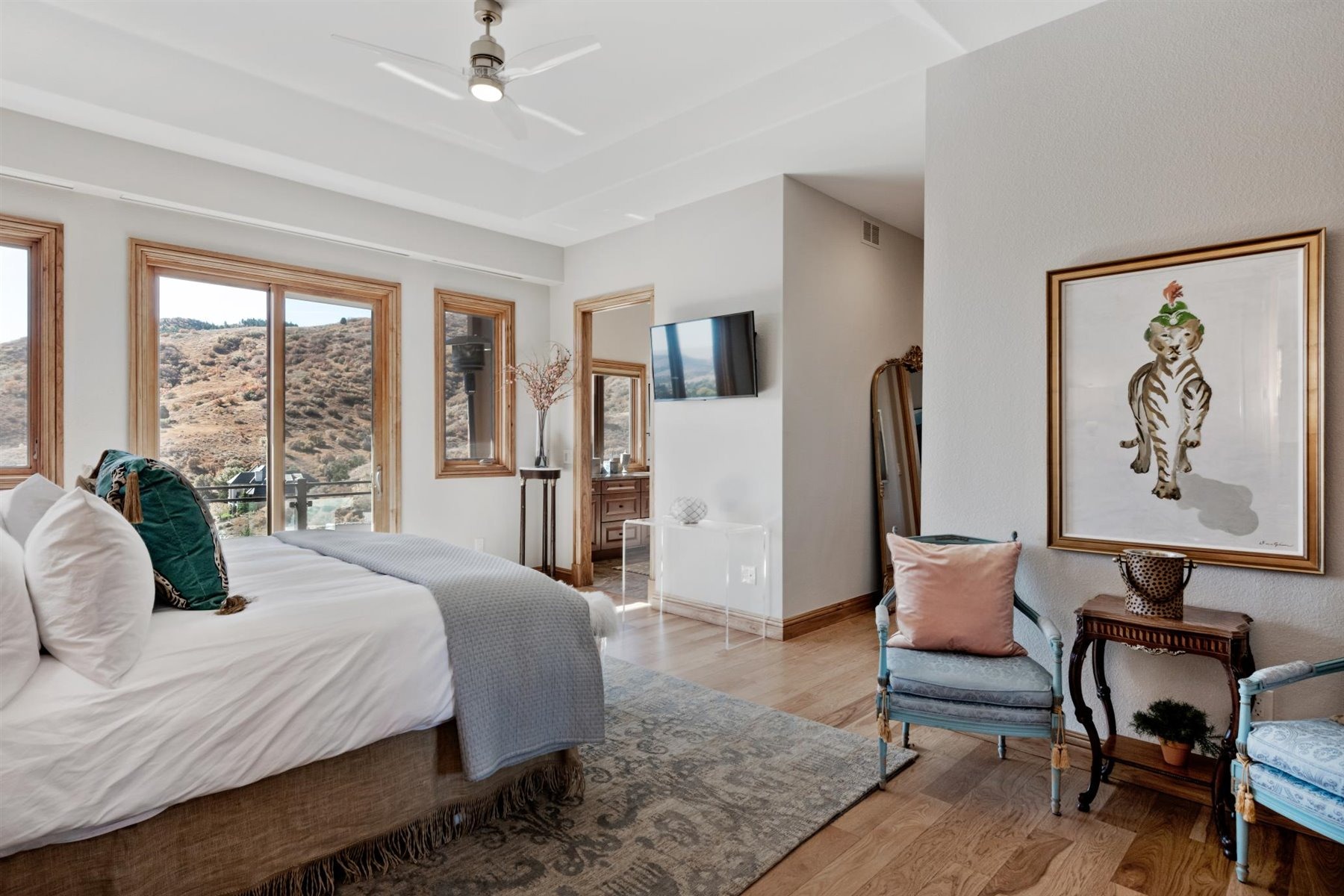 Large Master Bedroom with a deck & custom closets