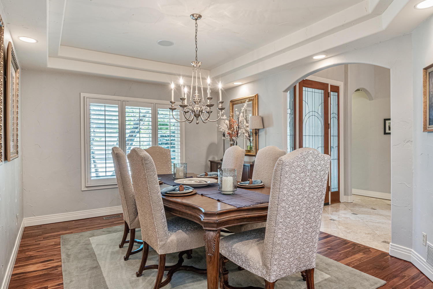 Spacious Open Formal Dining Room with Tray Ceiling