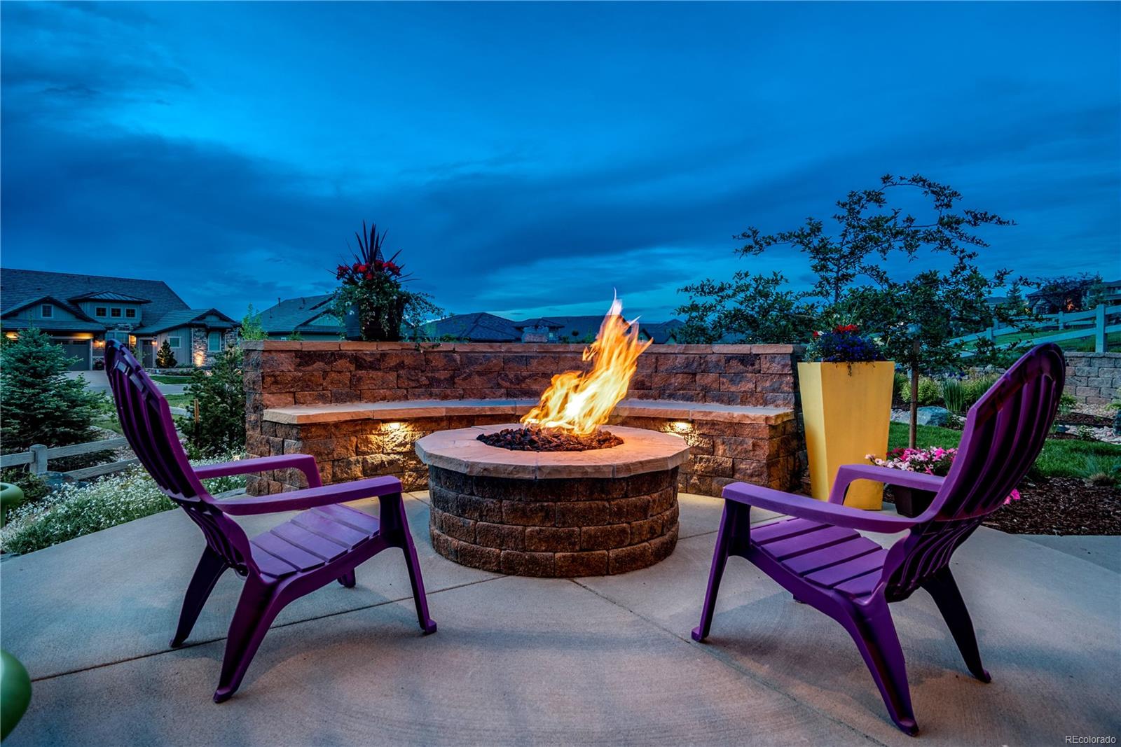 Extended privacy patio with beautiful gas fire pit.