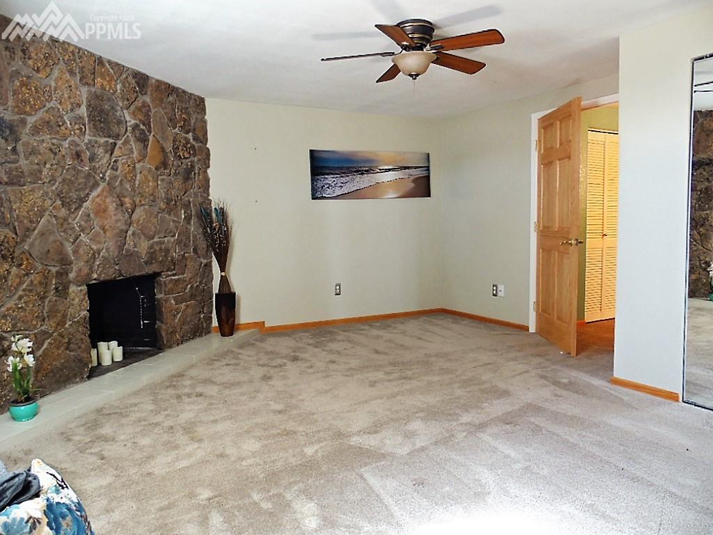 Downstairs Master Bedroom ~ 2nd Moss Rock Fireplace and Adjoining 5 Pc Bath