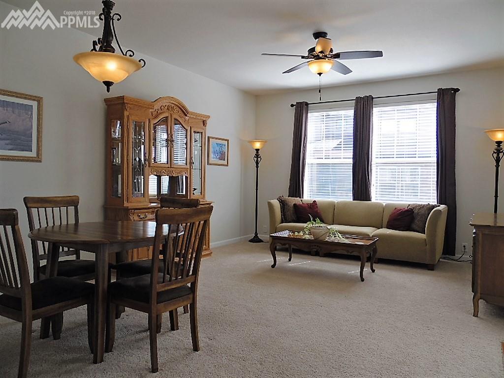 Open floor plan with updated bronze light fixtures