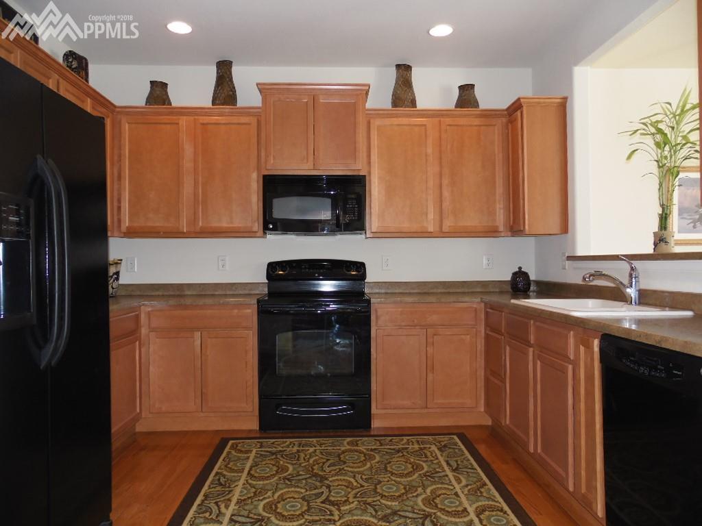 Cabinet and counter space! Upgraded cabinets! Wood Floors!