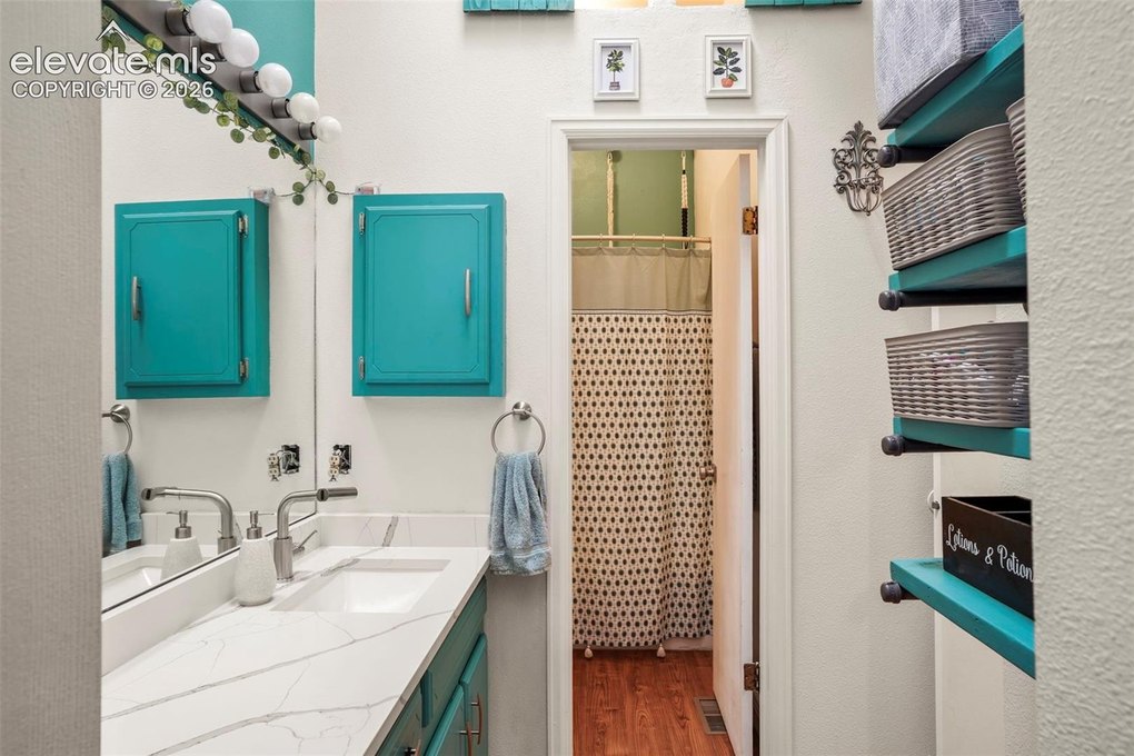 Quartz countertops and tons of storage in the primary bath.