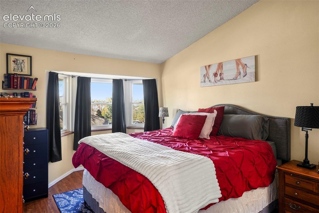 The large primary bedroom fits a king, large night stands and multiple dressers with ease. 
