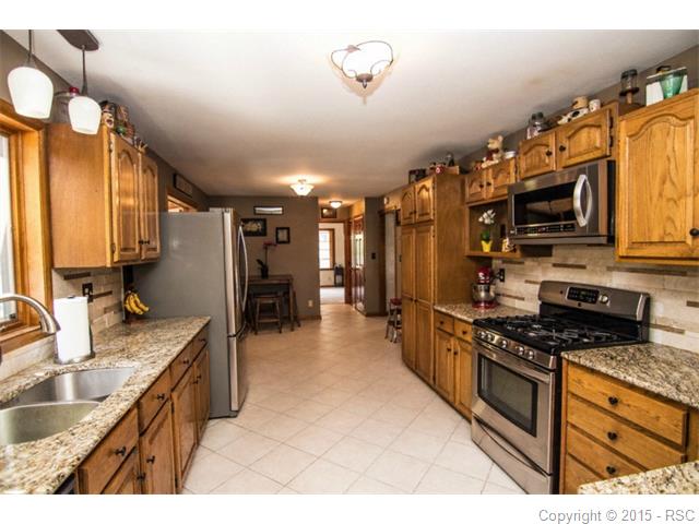 Updated kitchen with granite counters, stainless steel appliances and updated fi