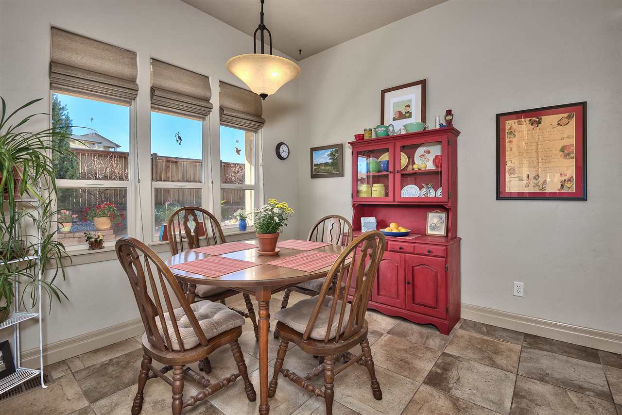 The breakfast nook boasts views into the professionally landscaped and private b