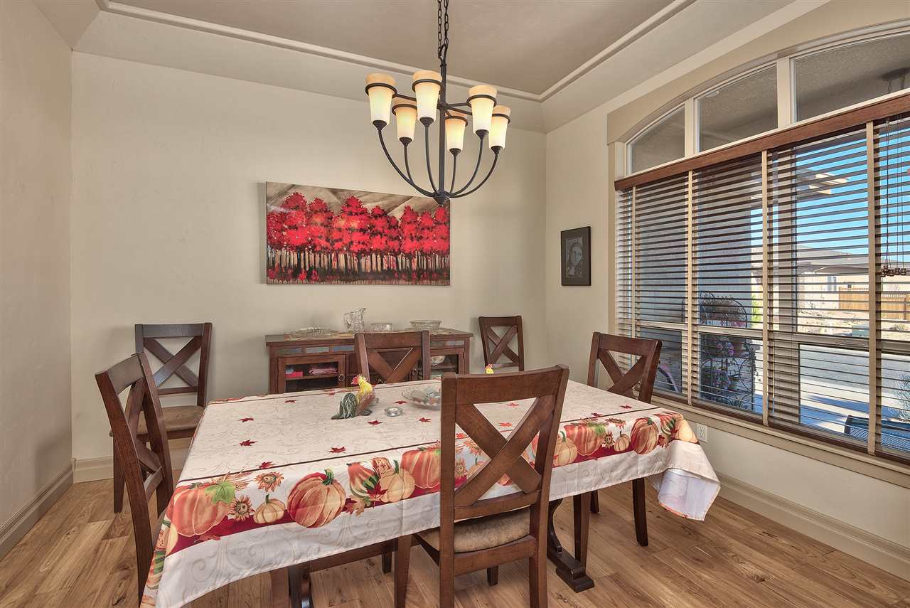 The classy formal dining room is steps from the kitchen & offers views east to w