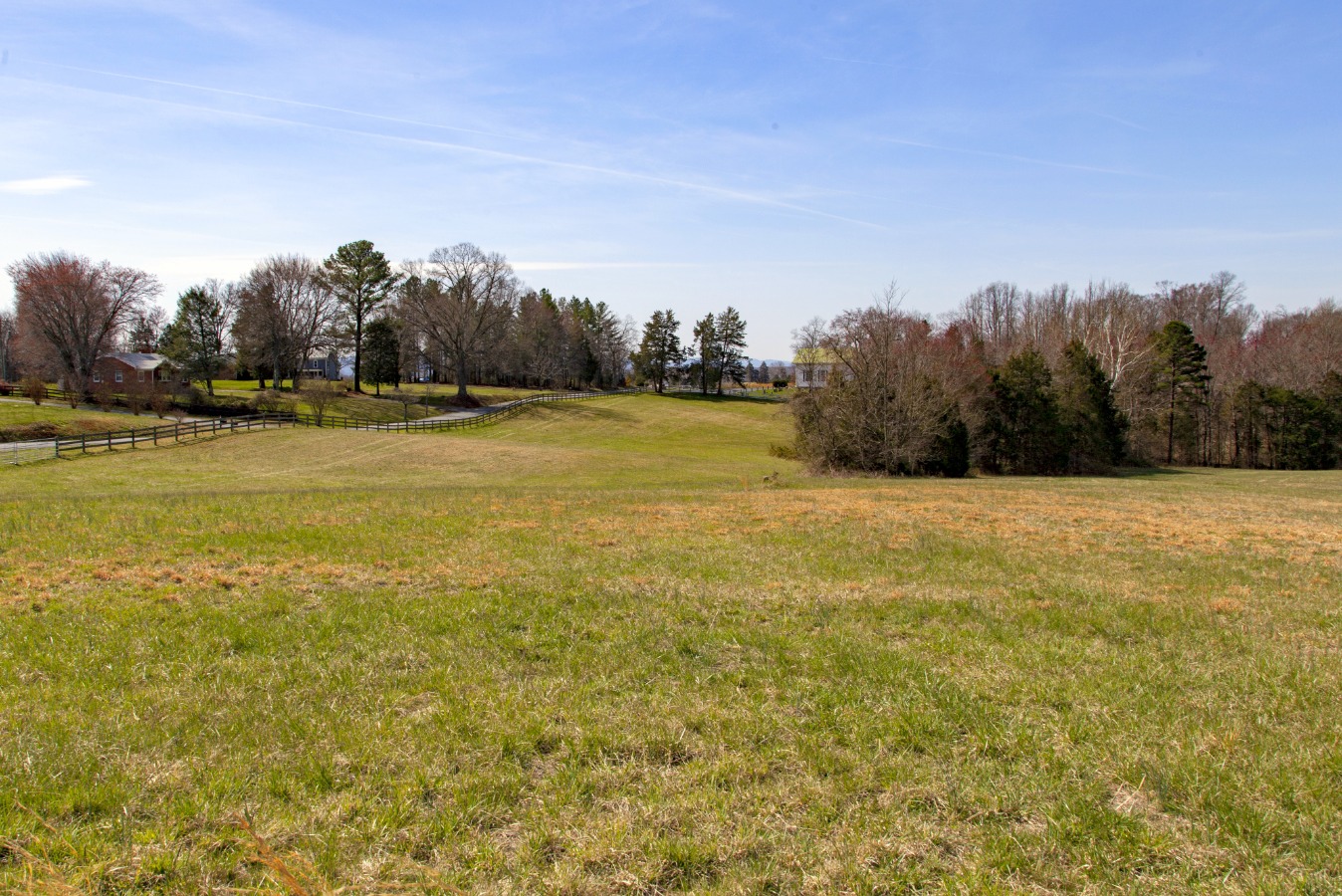 The front field fenced at the road