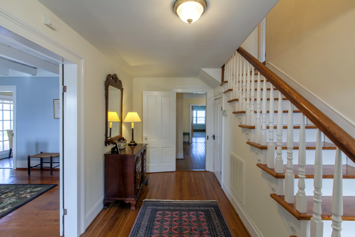 Inviting entry hall with heart pine stairs