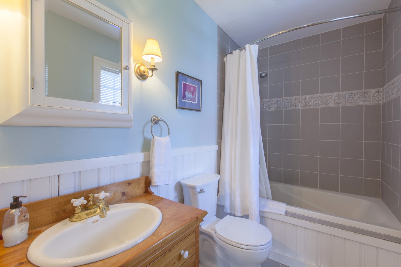 Master bath with ceramic tile and wainscoting