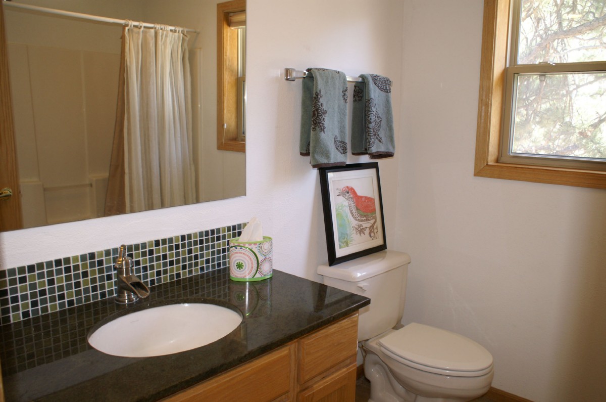 Guest bath with glass mosaci and granite counter