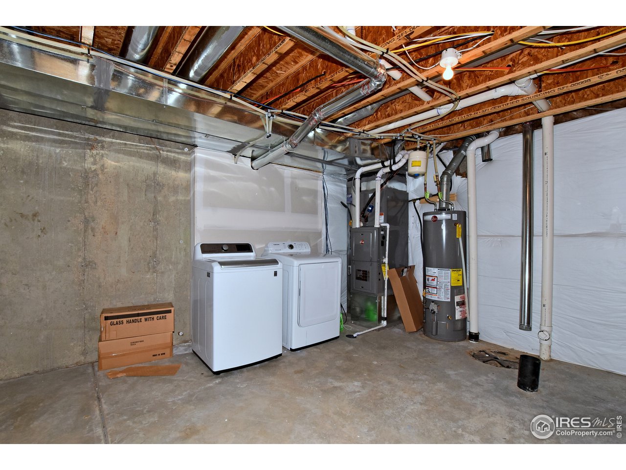 Basement Laundry Area   (Washer/Dryer negotiable)  High Efficiency Furnace, AC, 40 gallon water heater