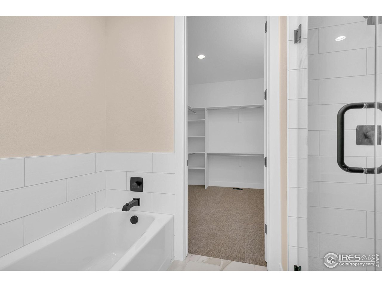 Full-height designer tile in showers and baths