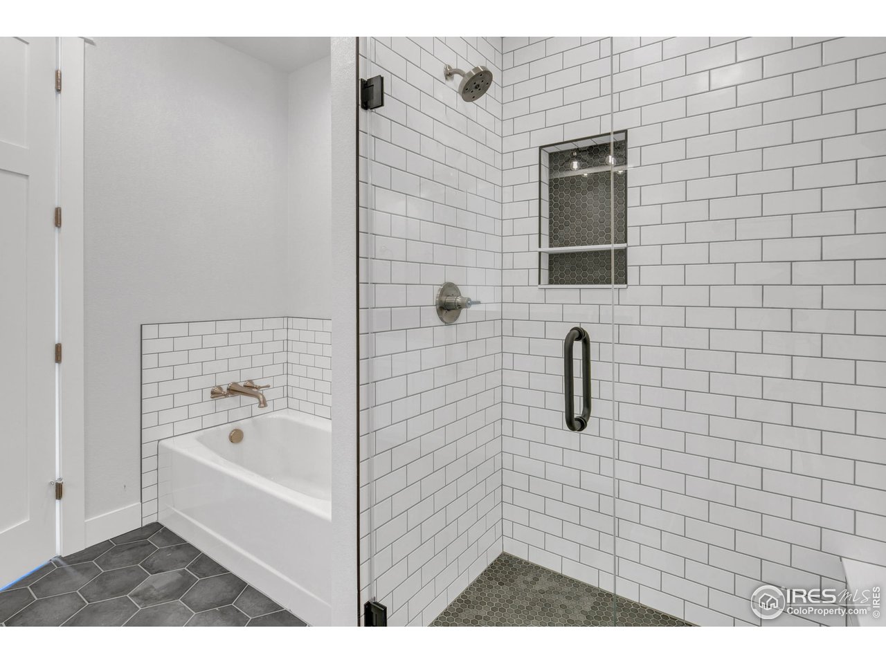 Floor to ceiling tiling in all showers, plus a soaker tub in the primary ensuite 
