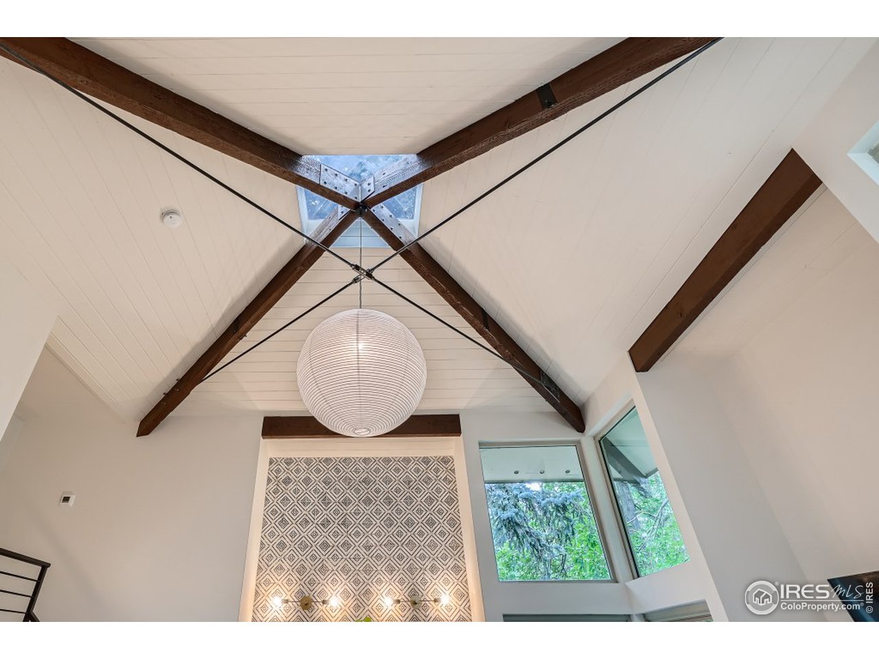 Lower level family room has artistic ceiling features