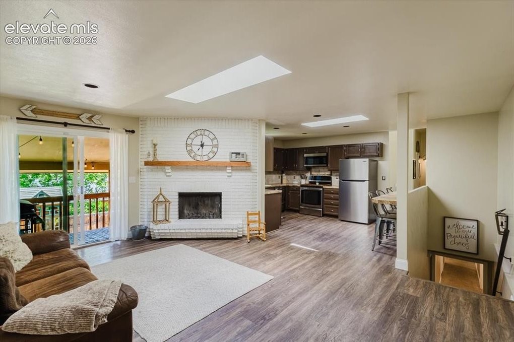 Wood Fireplace and walk out to covered deck. 