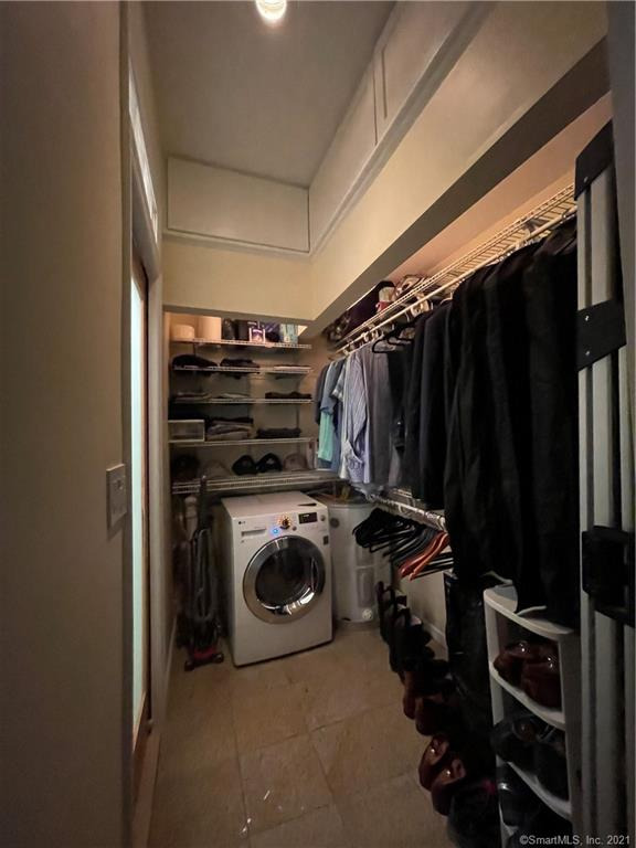 Walk in closet and laundry area
