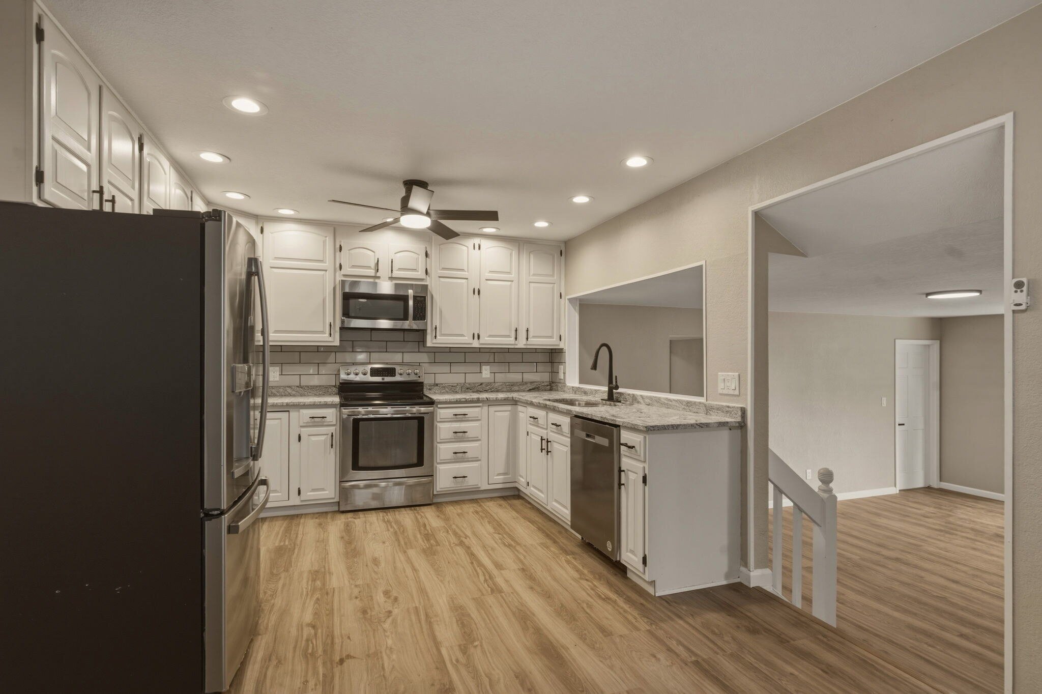 Updated Kitchen with stainless steel appliances and granite counters