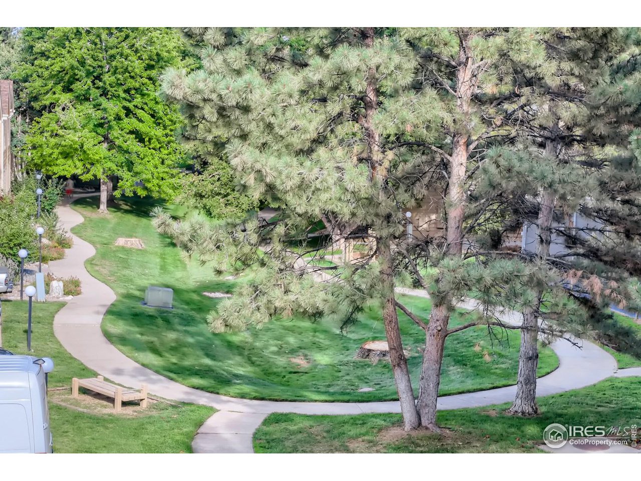 View from the primary bedroom. The path pictured here takes you to the tennis courts, sparkling pool and community park as well as Twin Lakes open space trail system.