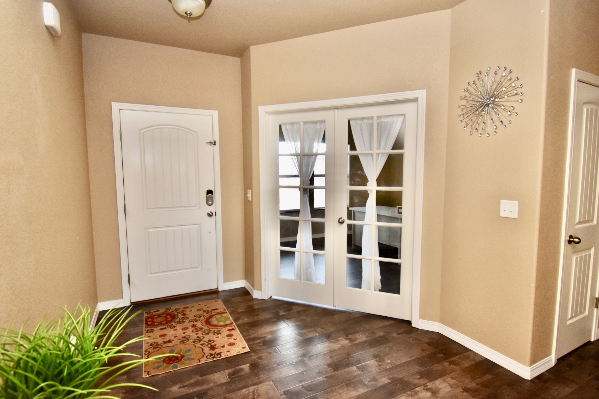 Foyer with French doors to flex space