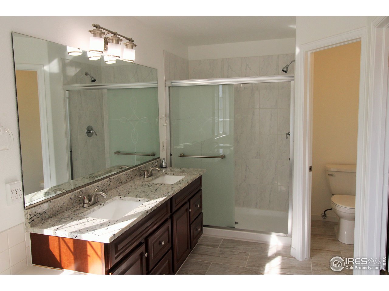 5-piece master bathroom with big shower, double vanity with granite countertops, tiled floors