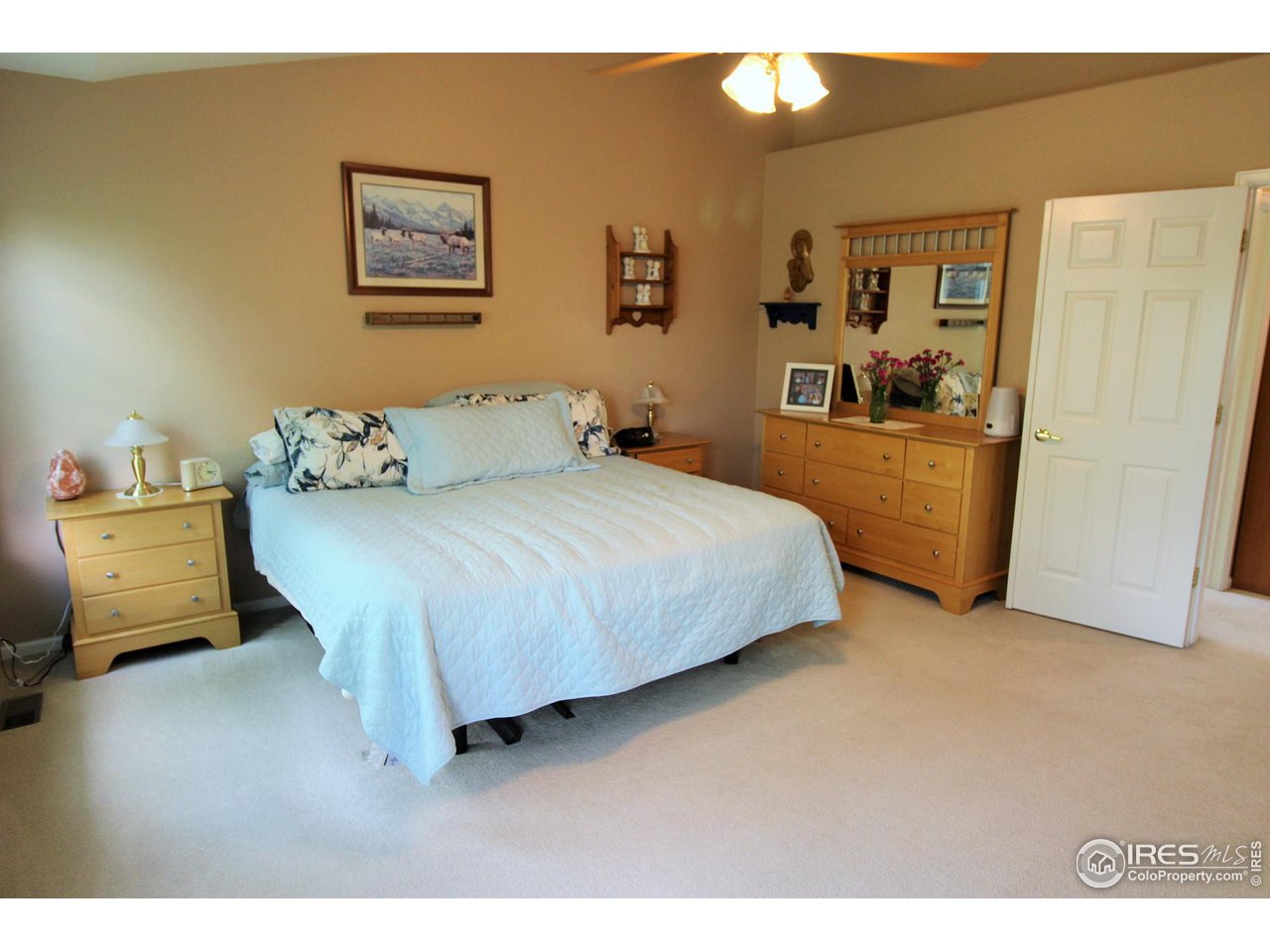 Large master suite with room for a king size bed, end tables and dressers.