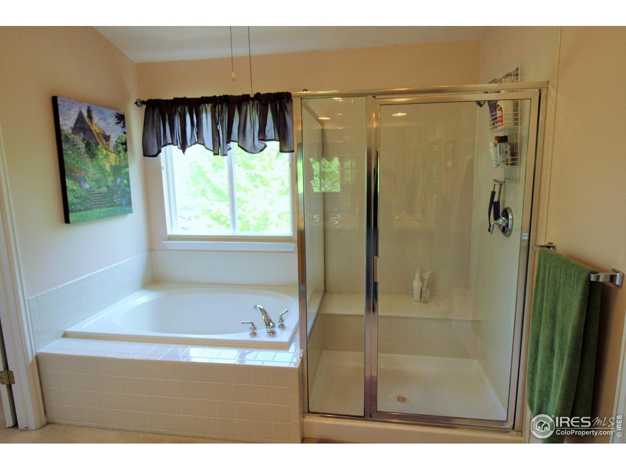 Private 5-piece master bath with soaking tub and big shower with built-in shower seat.