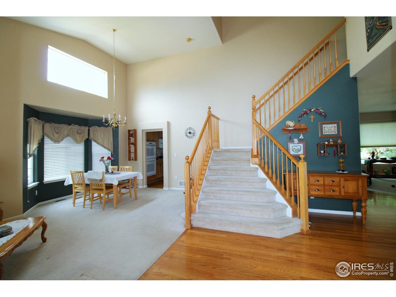 2-story entry with wood floors, open rail system for a bright open feeling.