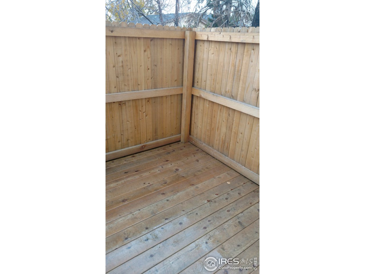 Privacy fenced yard with deck