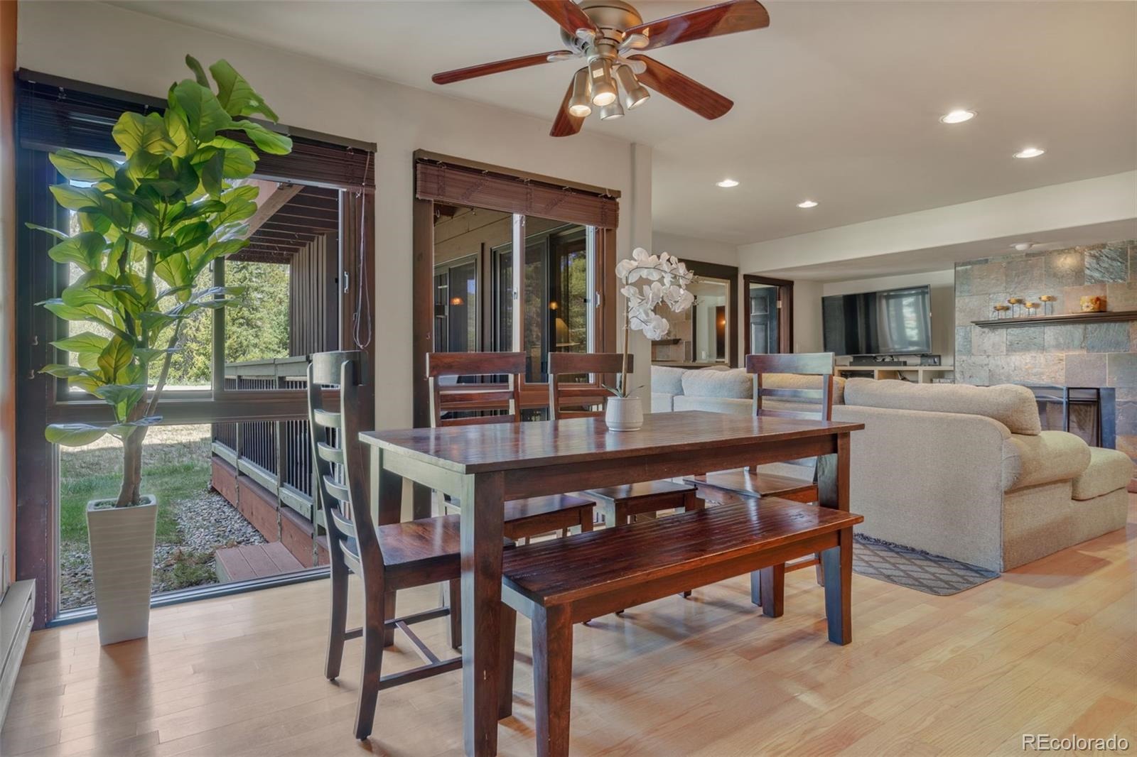 Dining area looks out window to deck