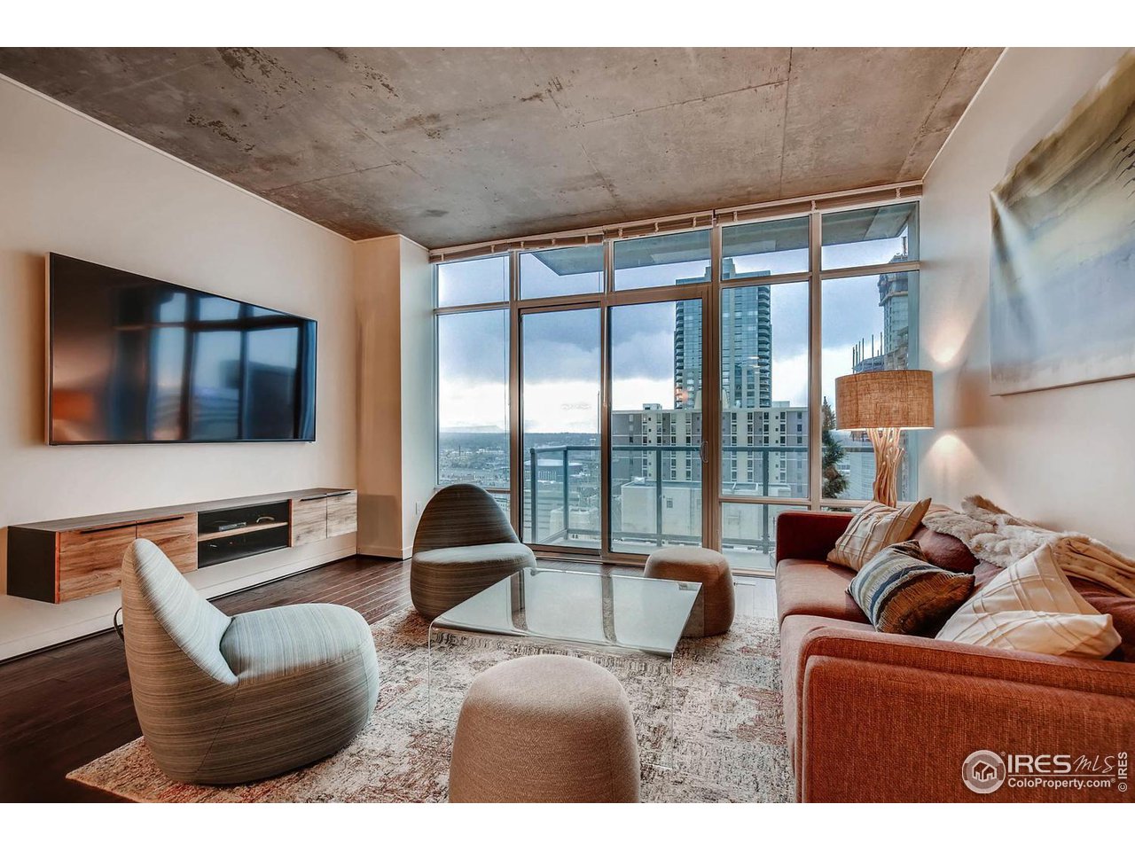 Living room with amazing Downtown and mountain views through the floor to ceiling windows.